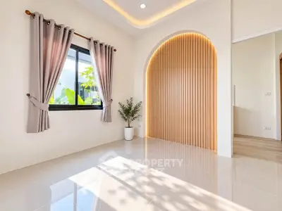 Bright and modern living room with elegant arch design and natural light