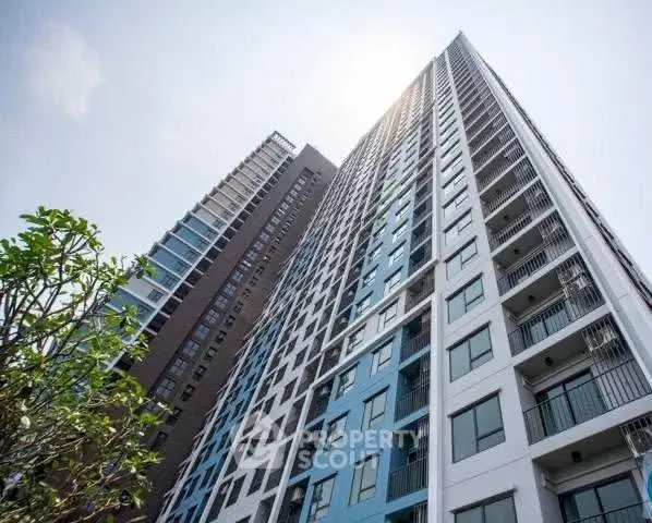 Stunning modern high-rise building with sleek design and expansive balconies.