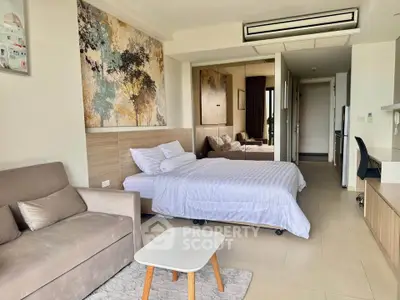 Modern studio apartment with cozy bed and stylish decor