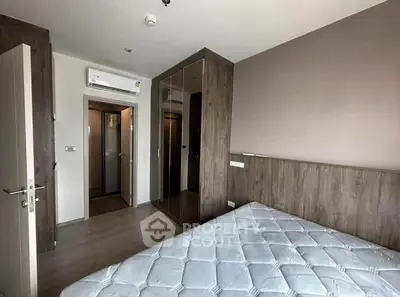 Modern bedroom with wooden accents and built-in wardrobe