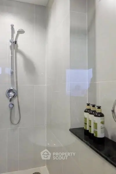 Modern bathroom with sleek shower design and elegant tile finish.