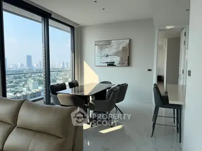 Luxurious modern living room with stunning city view and elegant dining area