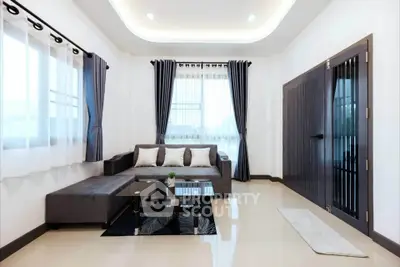 Modern living room with sleek furniture and elegant curtains, featuring a cozy sofa and stylish coffee table.