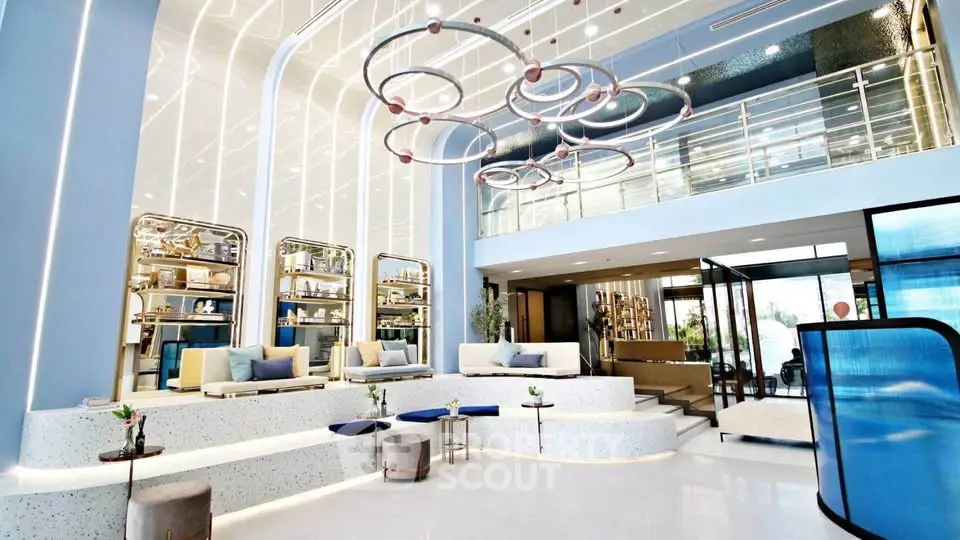 Luxurious modern lobby with elegant lighting and stylish seating area, perfect for upscale living.