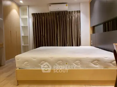Spacious bedroom with modern design and ample storage