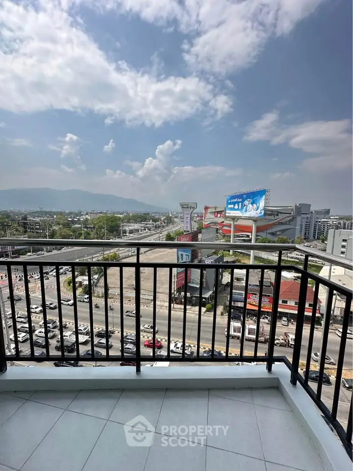 Stunning balcony view overlooking cityscape and mountains, perfect for urban living with scenic backdrop.