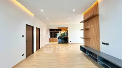 Spacious modern living room with open layout and stylish wooden accents