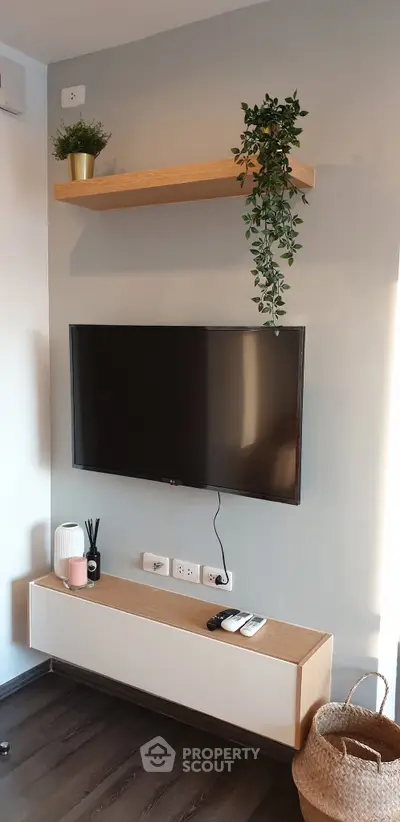 Modern living room with wall-mounted TV and stylish decor