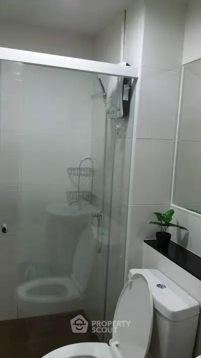 Modern bathroom with glass shower and sleek fixtures