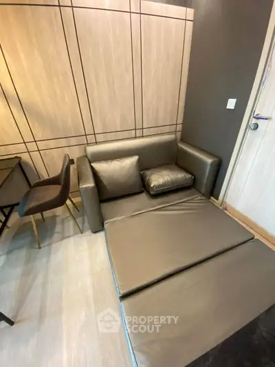 Modern living room with stylish fold-out sofa and elegant decor