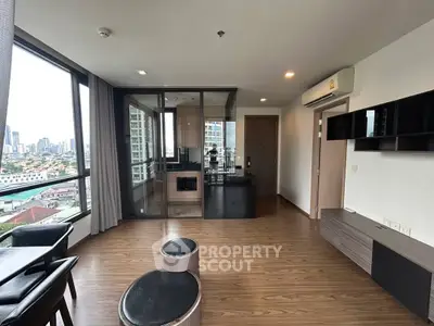 Modern living room with city view and sleek wooden flooring