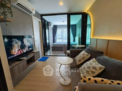 Modern living room with stylish decor and open view to bedroom