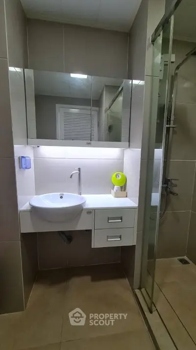Modern bathroom with sleek design and glass shower enclosure