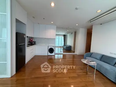 Spacious modern living room with open kitchen and hardwood floors