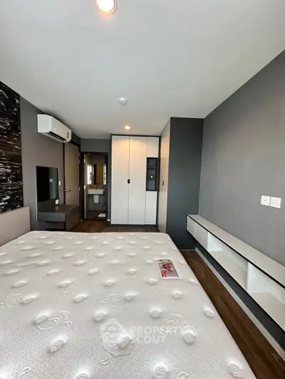 Modern bedroom with sleek design and built-in storage solutions