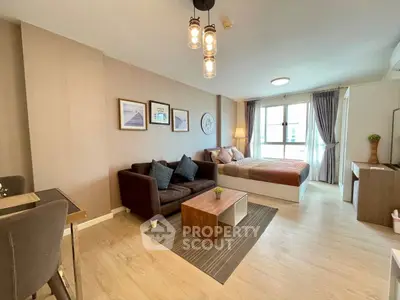 Modern studio apartment with cozy living area and stylish decor