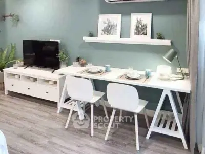 Modern living room with sleek white furniture and stylish decor