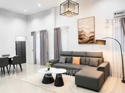 Modern living room with elegant decor and stylish furniture in a spacious open layout.