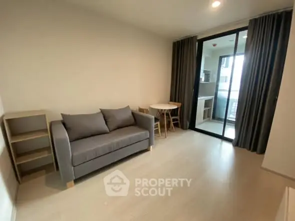 Modern living room with cozy sofa and balcony view in stylish apartment