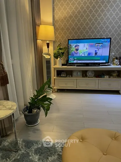 Cozy living room with elegant decor and modern TV setup