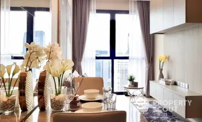 Elegantly furnished dining area with a modern aesthetic, featuring a stylish table set for four, complemented by chic decor and natural light from floor-to-ceiling windows, offering a glimpse of the cityscape.