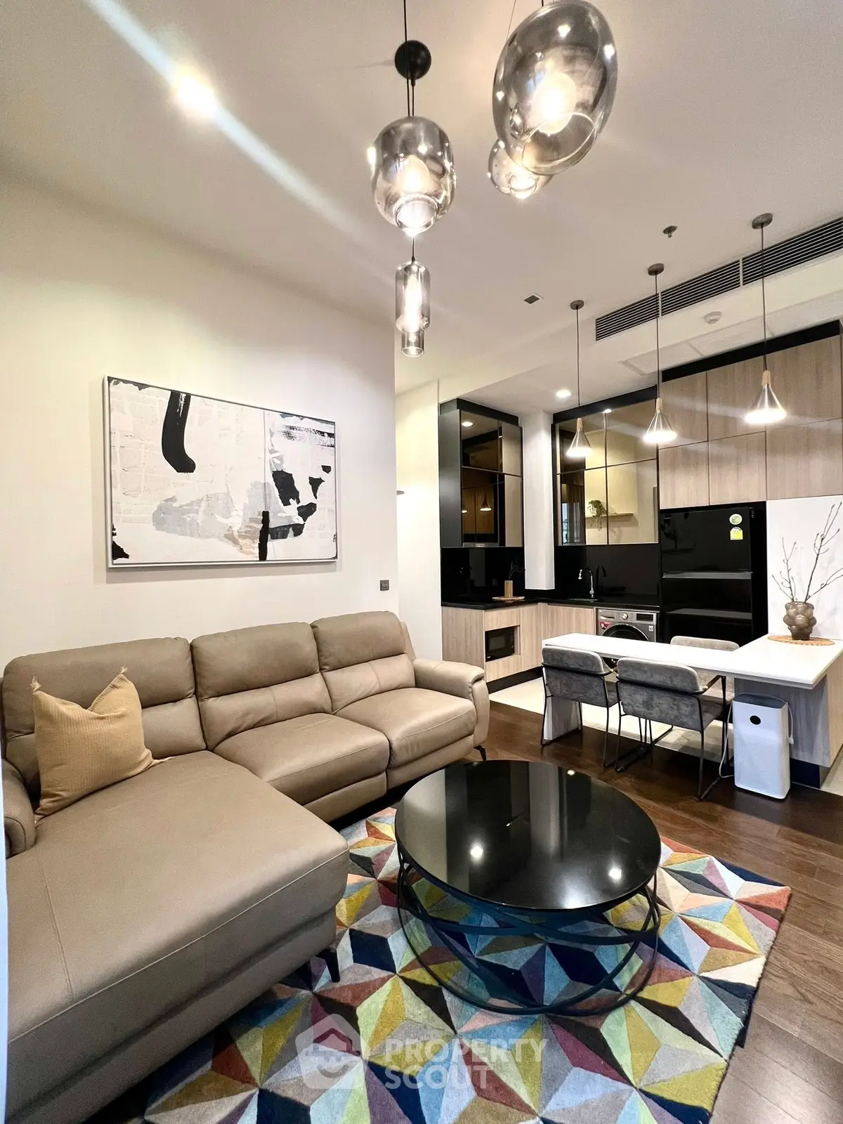 Modern living room with stylish decor and open kitchen layout