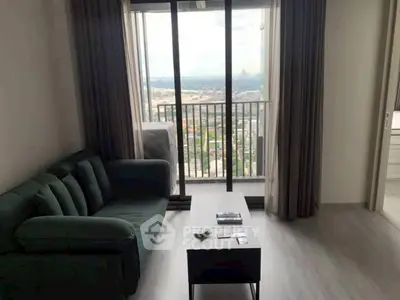 Modern living room with balcony view in high-rise apartment