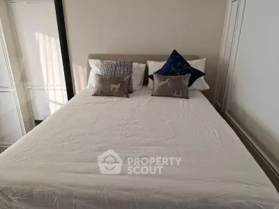 Cozy bedroom with stylish pillows and elegant decor