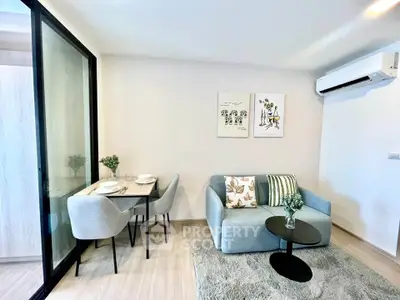 Modern living room with cozy sofa, dining area, and air conditioning in a stylish apartment.