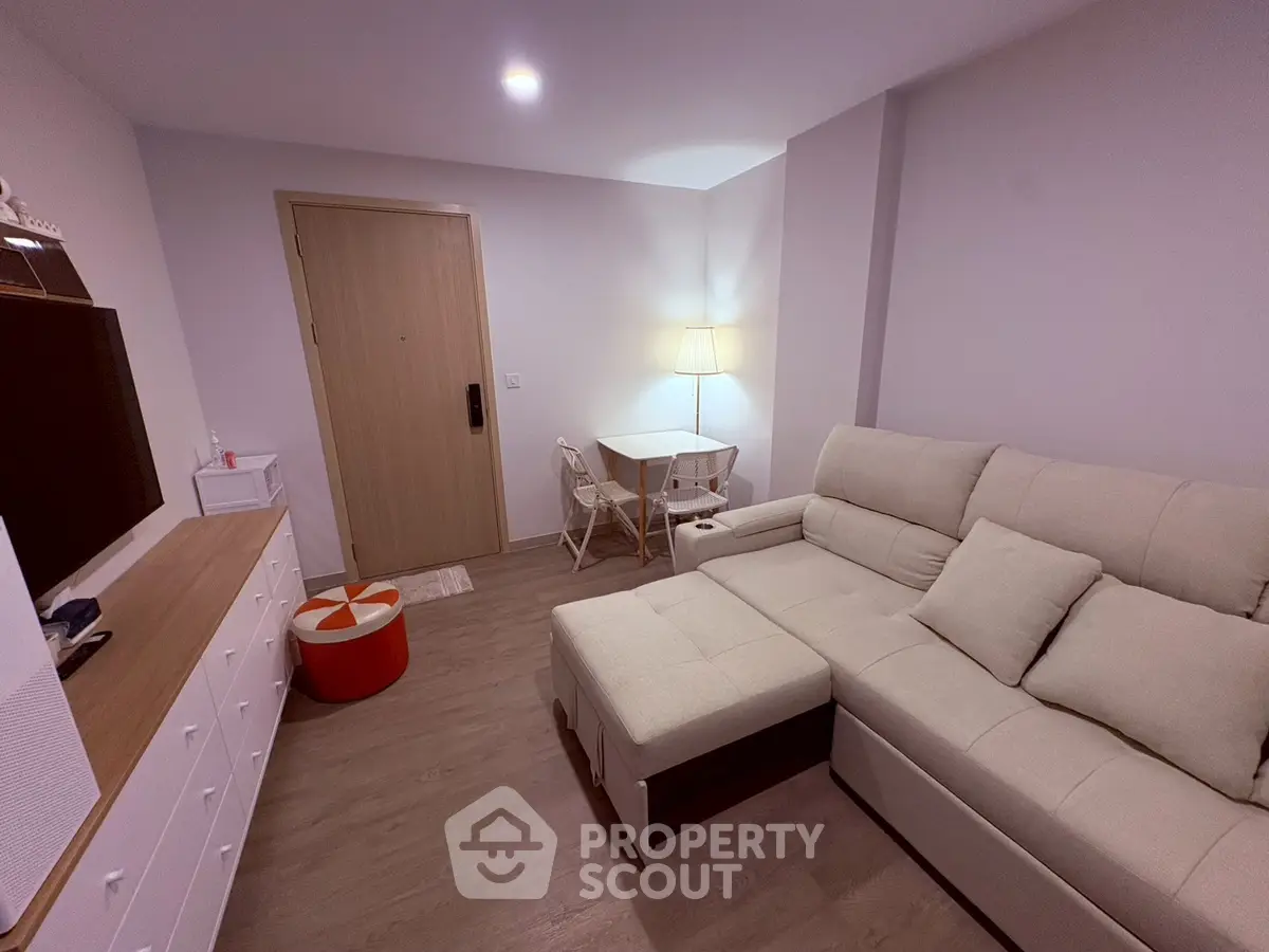 Cozy living room with modern furniture and soft lighting, perfect for relaxation and entertainment.