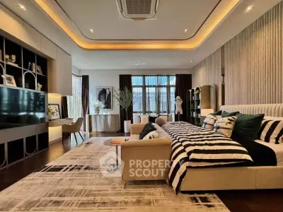 Luxurious modern living room with stylish decor and ample natural light.