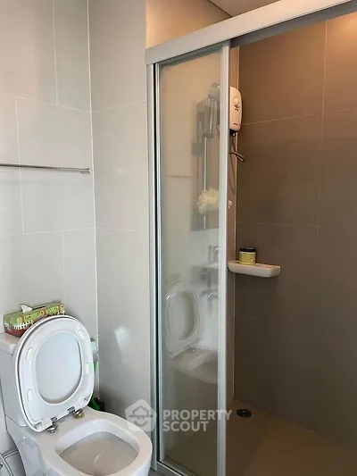 Modern bathroom with shower and toilet in sleek design