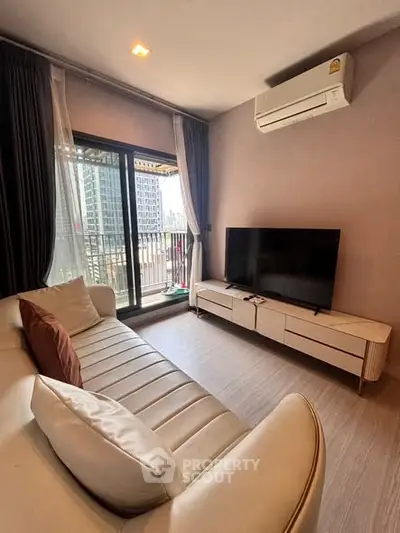 Modern living room with balcony view in a high-rise apartment