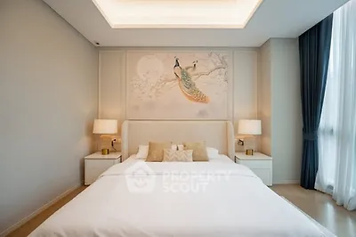Luxurious bedroom with elegant decor and large window for natural light.