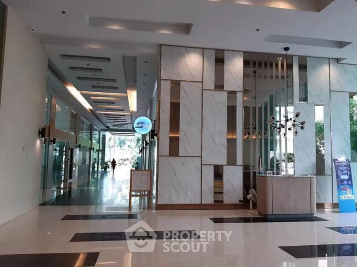 Luxurious modern building entrance with marble walls and sleek design