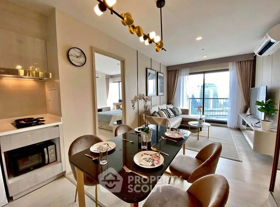 Modern open-plan living room with dining area and city view balcony in luxury apartment.