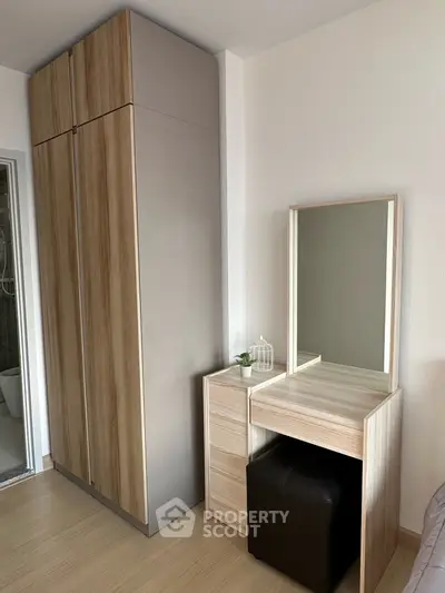 Modern bedroom with sleek wardrobe and stylish vanity set