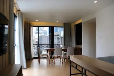 Spacious modern living room with large windows and city view
