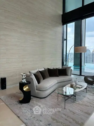 Luxurious living room with stunning city view and elegant modern furniture.
