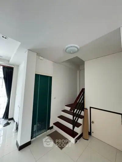 Modern interior with staircase and natural light, ideal for stylish living.