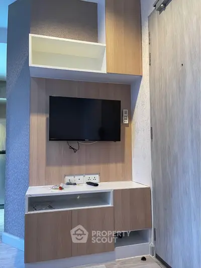 Modern living room with sleek TV unit and stylish cabinetry