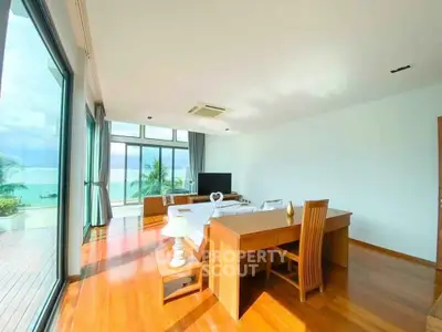 Spacious living room with ocean view and elegant wooden furniture