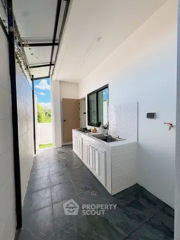 Modern outdoor kitchen with sleek design and natural light
