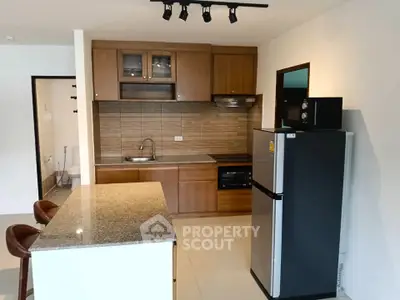 Modern kitchen with granite island and wooden cabinets in open layout
