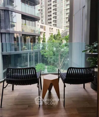 Modern balcony with stylish seating and stunning city view