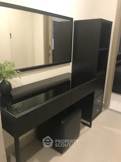 Modern black vanity set with mirror in a stylish bedroom corner