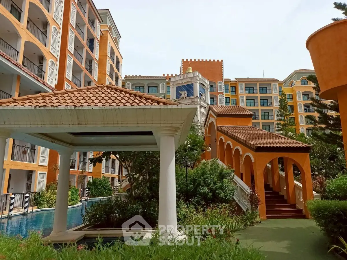 Luxurious Mediterranean-style apartment complex with pool and lush gardens