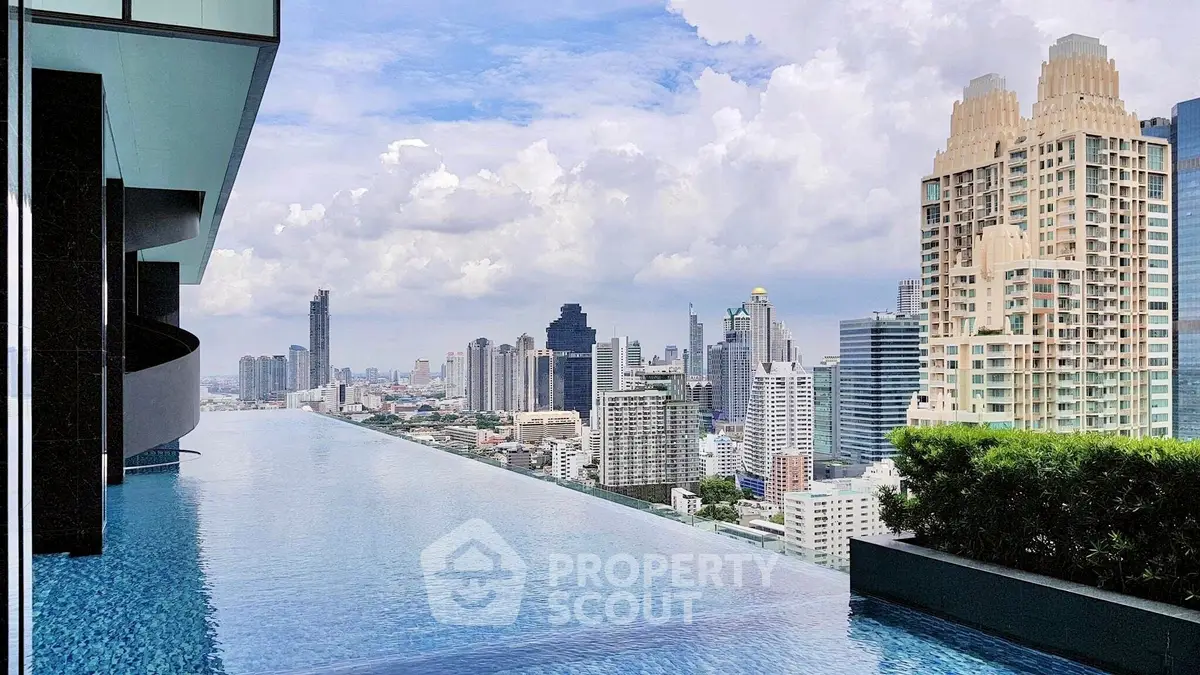 Stunning rooftop infinity pool with breathtaking city skyline view
