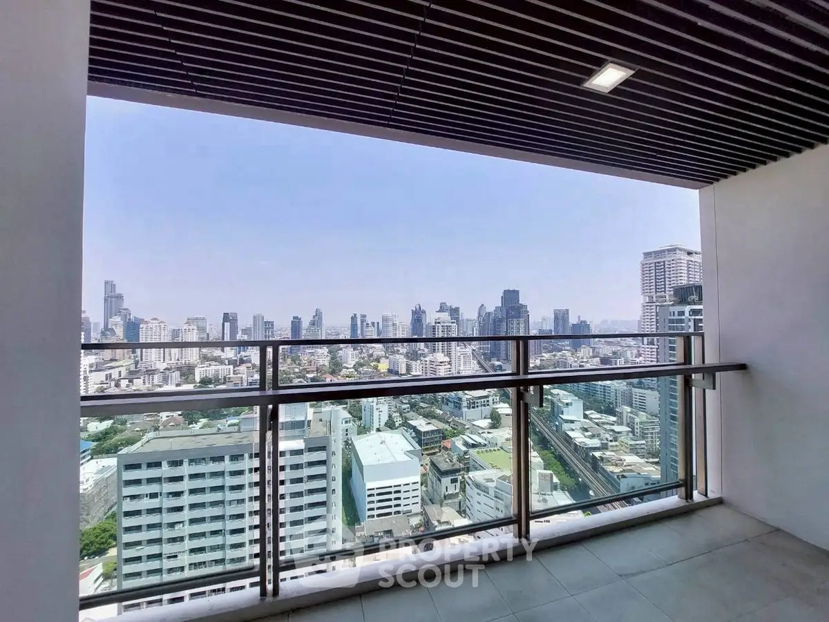 Stunning cityscape view from a modern high-rise balcony, perfect for urban living enthusiasts.