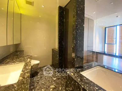 Luxurious modern bathroom with marble finishes and elegant fixtures
